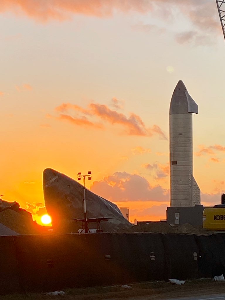 Sunset over the SpaceX Starbase facility seen from Boca Chica